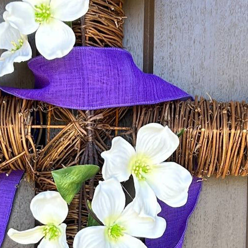 twig cross with dogwood branch and purple ribbon