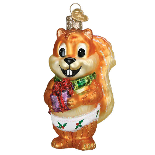 The Silly Christmas Squirrel Ornament by Old World Christmas (product number 12683) features a cheerful squirrel holding a red and purple gift, adorned with a festive white and green outfit. It includes a golden loop for easy hanging.