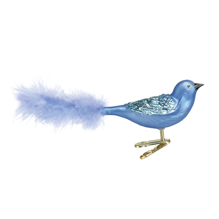 The Brilliant Songbird 18011 Old World Christmas Ornament features a blue bird with a glittery wing, fluffy feather tail, and gold clip—perfect for adding festive charm to your décor.