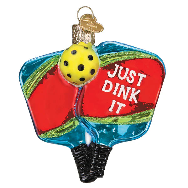 Celebrate pickleball with the Pickleball Paddles Old World Christmas Ornament 44235—two red paddles crossed with a yellow ball and "JUST DINK IT," perfect for any fan of the game!.