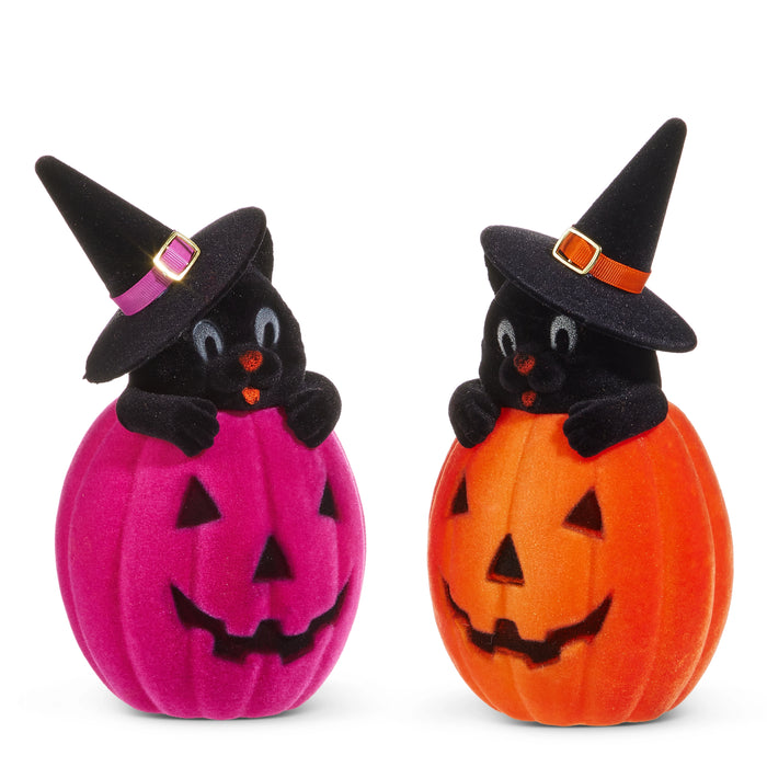 The 10" Flocked Cat in a Jack-O-Lantern (4540849) features cute cats in witch hats peeking from purple and orange Jack-O-Lanterns, both with smiling faces—perfect for charming Halloween décor.