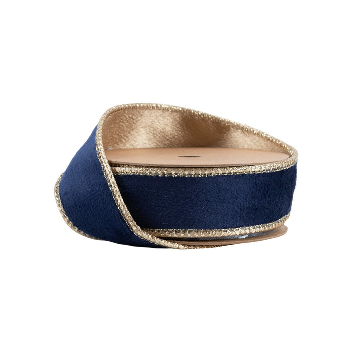 A spool of 1" Navy and Gold Reversible Classic Velvet Ribbon (7115W-374-25E) with metallic edges is partially unrolled and coiled, displayed against a white background.