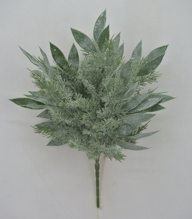 The 21 Green Mixed Cypress Olive Leaves Bush (83655) features broad and needle-like foliage with a frosty, glittery finish, all arranged against a simple light background.