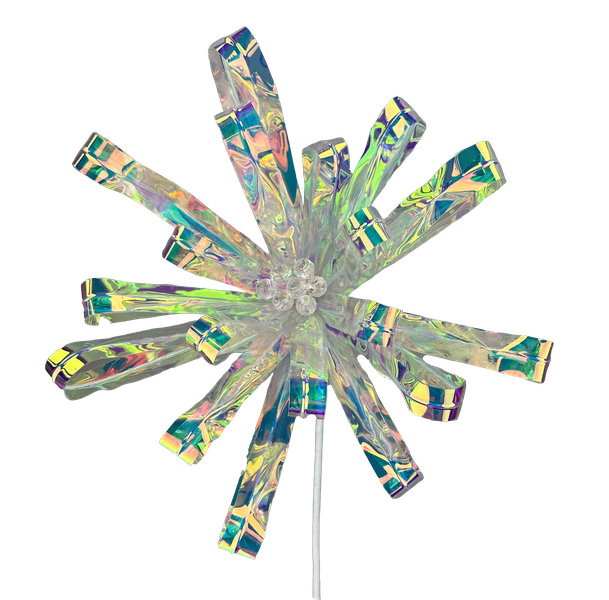 Introducing the 24" by 10" Flower Stem 86064IRDS: This ornament features a shimmering, iridescent star shape adorned with a central cluster of sparkling gems. Its elongated, translucent petals are symmetrically arranged like those of a flower stem, displaying a stunning rainbow-like pattern. The ornament is elegantly attached to a thin metallic stem.