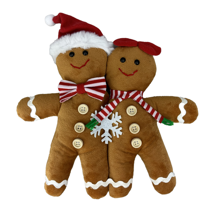 The 13 x 11 x 1 Brown Plush Gingerbread Pair Ornament (86129BN) features two smiling gingerbread figures with festive red and white accessories, decorated with buttons and a snowflake.