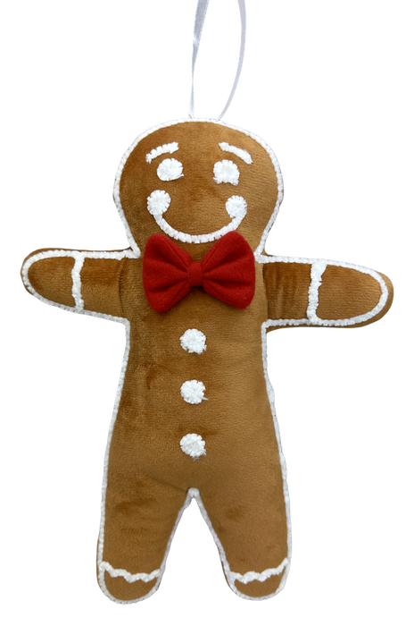 The 13 x 10 x 3 Brown Plush Gingerbread Man (86365BOY) features white icing details, a smiling face, three buttons, and a red bow tie, and hangs from a white ribbon.