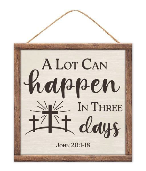 The 10SQ Grey Brown Three Days Sign (AP7377) features a wooden frame with the phrase A Lot Can Happen In Three Days, John 20:1-18, and three crosses against a sunrise illustration, crafted from grey-brown MDF paper.