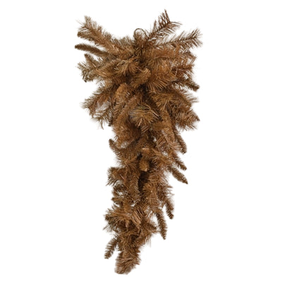 The 30 Brown Mixed Pine Teardrop with 90 Ties (DC30TDBR) features dense, downward-hanging branches and is beautifully displayed against a white wall and wooden floor.