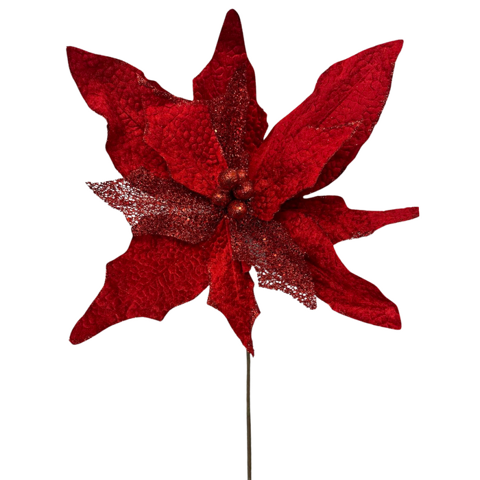 The 20 Diameter Red Super Jumbo Velvet Poinsettia (ISB67312) features textured petals with glitter accents on a green stem, creating a bold holiday display against any background.