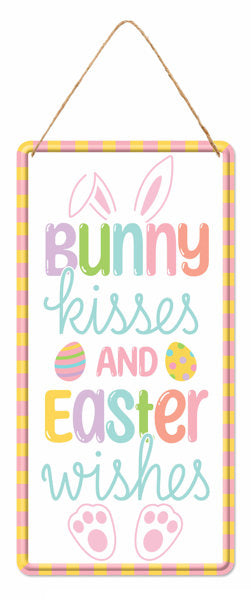 Bring Easter cheer to your home with our 12H x 6L White Pastel Multi Embossed Bunny Kisses Sign (MD1513), featuring soft pastel stripes, bunny ears, eggs, and sweet Bunny kisses and Easter wishes text—perfect festive décor!.
