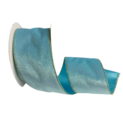 A spool of 2.5 Light Blue Velvet with Satin Back Ribbon R32937 featuring a shiny texture and gold trim is partially unraveled.
