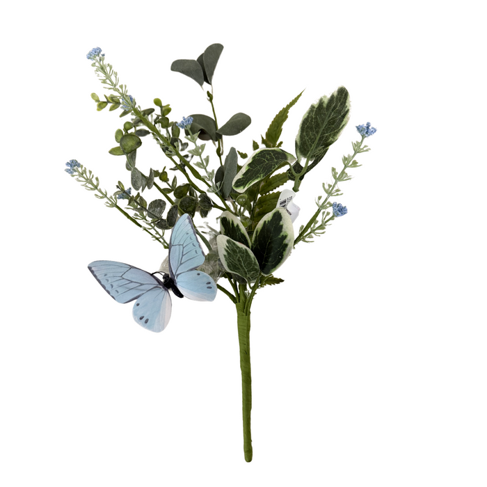 The 14 Assorted Papillion Garden Pick (MTF24218) features a small bouquet of artificial green leaves, tiny blue flowers, and is beautifully accented with a light blue butterfly on one of the stems.