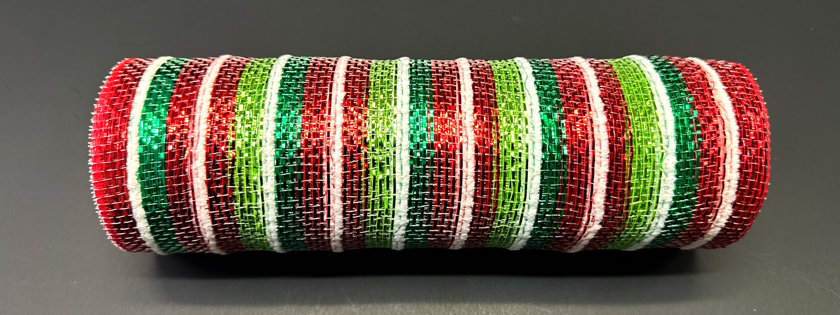 The 10X10Y Red-Lime-Emerald Metallic Stripe/White Fuzzy Mesh (XB241110-17) features shiny red, lime, and emerald stripes with white fuzzy mesh, shown against a dark background.