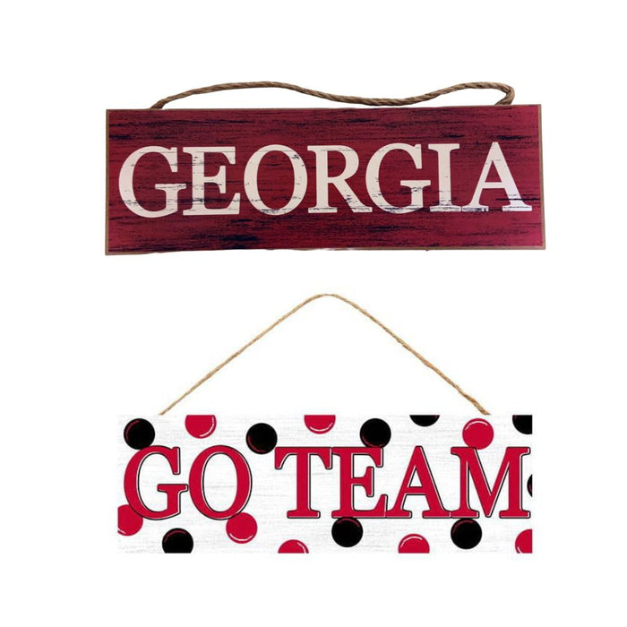 The Red Black Georgia or Go Team Assorted Wall Hanging (AP809899) features two MDF wooden signs: a maroon GEORGIA in white letters, and a white GO TEAM with red/black polka dots and bold red text. Both signs are suspended by a cord for an energetic decor accent.