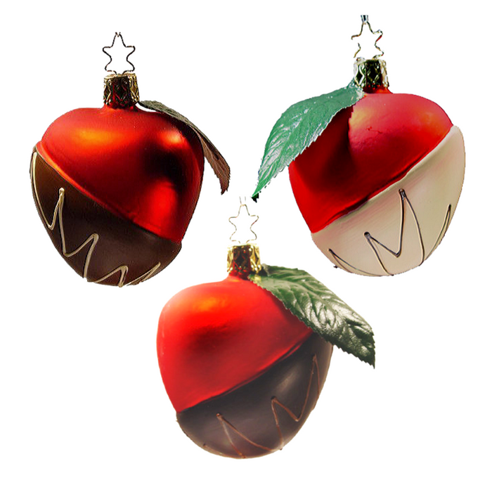 The Chocolate Dipped Candy Apple Christmas Ornament by Inge-Glas of Germany features a handcrafted blown glass apple with a shiny red top, chocolate-dipped bottom, green leaf, and gold star-shaped hook.
