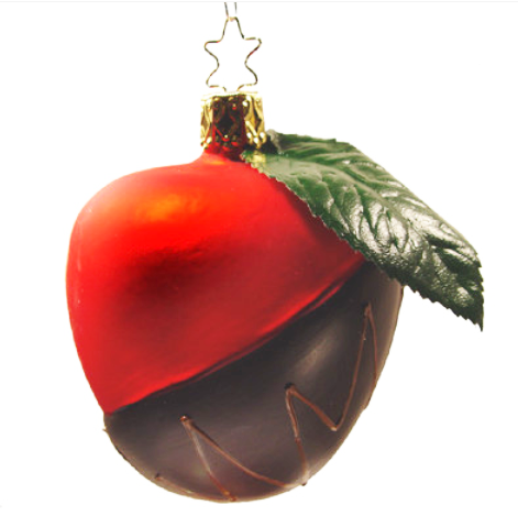 A handcrafted blown glass ornament shaped like a chocolate-dipped candy apple with a red top, brown dipped bottom, green leaf, and gold cap with star hook—Chocolate Dipped Candy Apple Ornament by Inge-Glas of Germany.