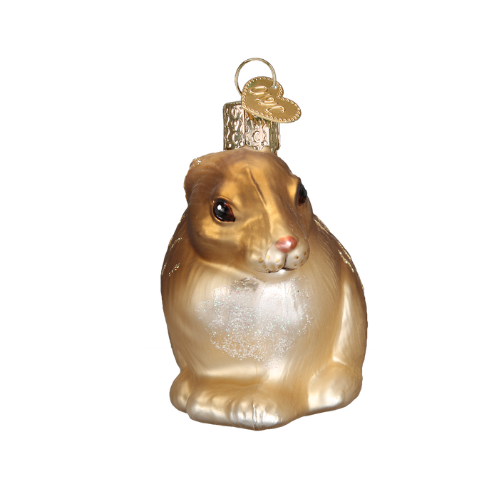The Cottontail Bunny 12192 Old World Christmas Ornament Assorted is a hand-painted glass decoration shaped like a brown and white bunny, featuring a gold cap and charm for easy hanging.
