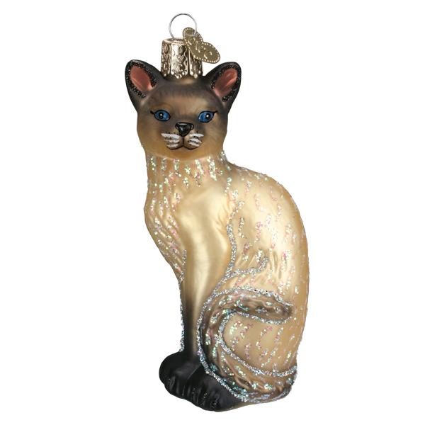 The Tan Siamese Cat Ornament from Old World Christmas (12617) showcases a sitting Siamese cat embellished with sparkling details and captivating blue eyes. A decorative gold cap and loop make it an excellent choice for hanging, celebrating the charm of this beloved pet.