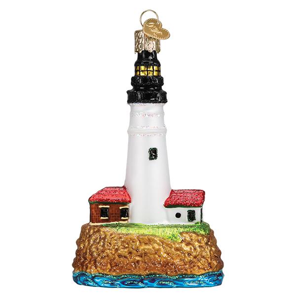 Add coastal charm to your tree with the Portland Head Lighthouse Old World Christmas Ornament 20117—crafted in glass, featuring two red-roofed buildings on a rocky cliff above blue waves, and finished with a gold hanging loop.