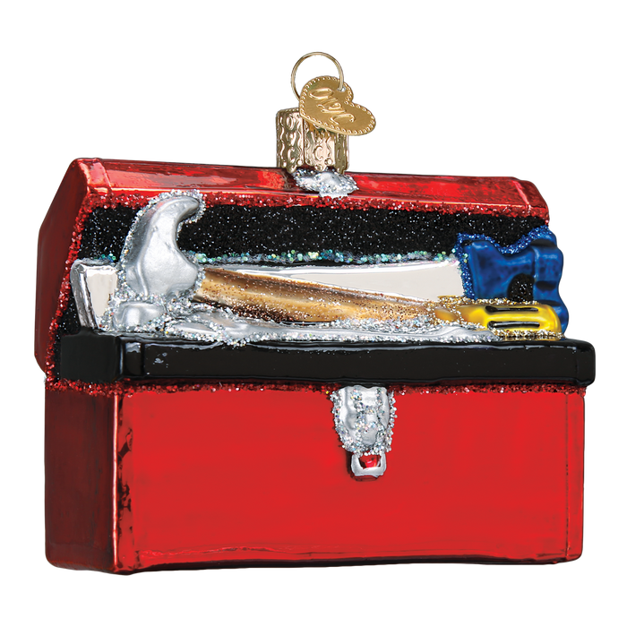 The Toolbox Ornament Old World Christmas Ornament 32301 features a shiny red box with a silver hammer and blue-handled tool, glitter accents, and a gold hanging loop—an ideal builder gift.