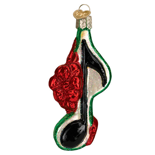 Add festive flair to your tree with the Musical Note With Bow-green Ornament from Old World Christmas (38061), featuring a glittery black note with a large red flower and green-white trim—perfect for holiday carols.