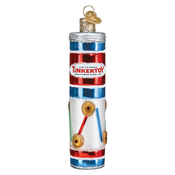 Introducing the Tinkertoy Ornament by Old World Christmas (Product 44188), a vibrant holiday decoration that resembles a vintage canister adorned with bold red, blue, and white stripes. This ornament showcases images of connected rods and wheels, making it an ideal choice for inspiring creativity and engineering skills during the festive season.