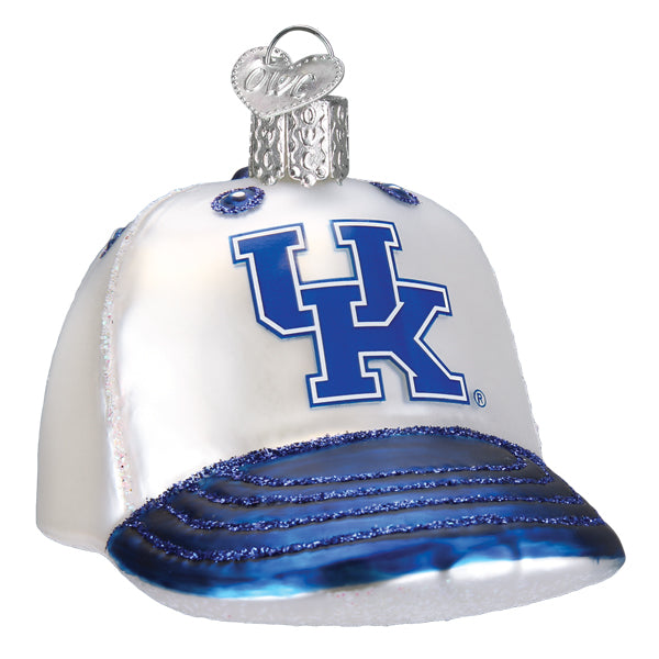 The Kentucky Baseball Cap Ornament (Old World Christmas 62519) is a glass decoration featuring a white and blue cap with the University of Kentucky UK logo on the front.