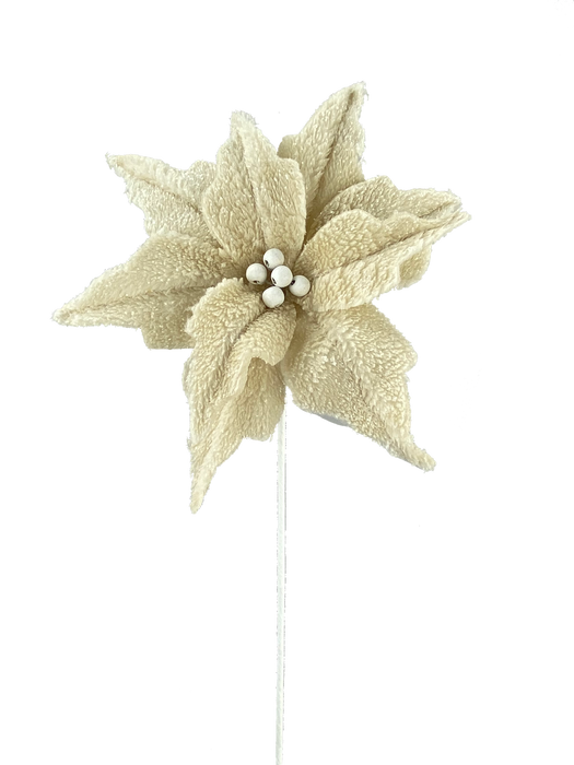 The 28 Brown Poinsettia Pick (85634BN) features cream-colored, textured fabric petals with small white bead centers on a slim brown stem, shown against a solid black background.