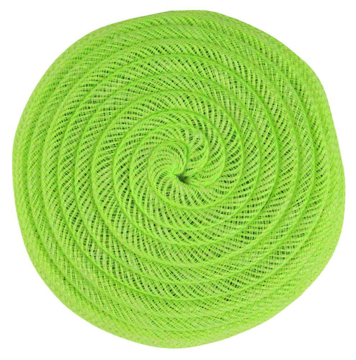 The 6.75Dia Jute Flex Tubing Flower Center in Fresh Green (FJ5182N9) features a tightly coiled mesh rope that forms a circular spiral, resembling a flat disk or the center of a flower viewed from above.