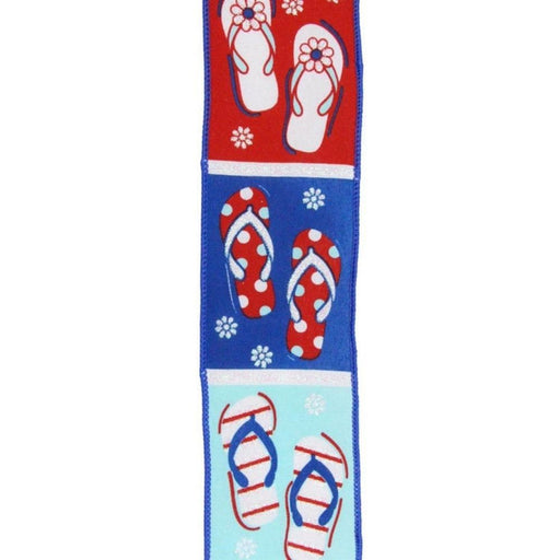 The 2.5X10Yd Patriotic Flip Flops RGE1178 features an illustrated design with three pairs of flip-flops on vibrant red, blue, and teal backgrounds. Each pair boasts whimsical patterns like flowers and polka dots with small white floral accents, creating a playful red, white, and blue patriotic vibe.