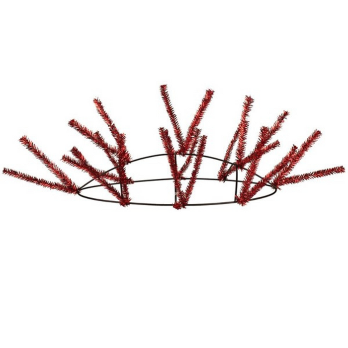 The Work Oval Table Piece Red Metallic 15" (XX747924) features a circular metal form with red tinsel branches, perfect as a festive centerpiece or holiday decoration, set against a plain white background.