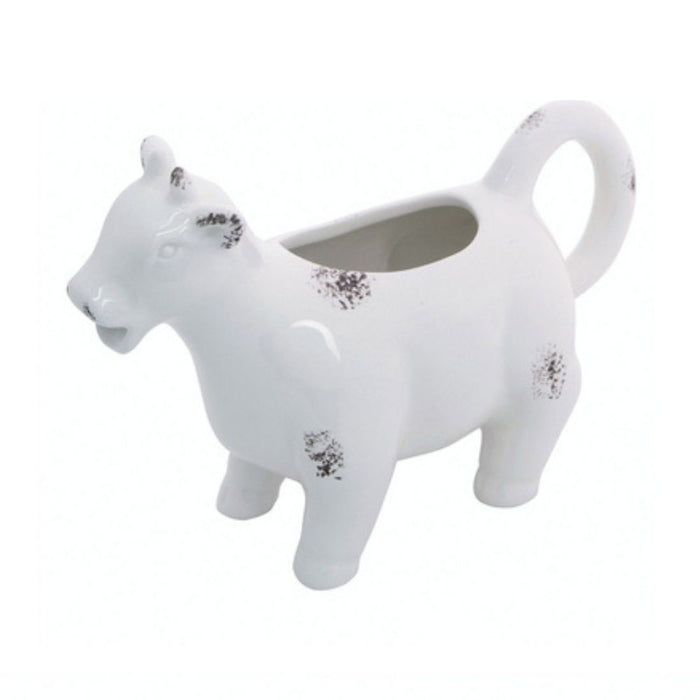 The Farm Animal Creamer Assorted A2536 is a whimsical ceramic creamer with black spots, a tail handle, spout mouth, and back opening—making it a charming addition to any table.