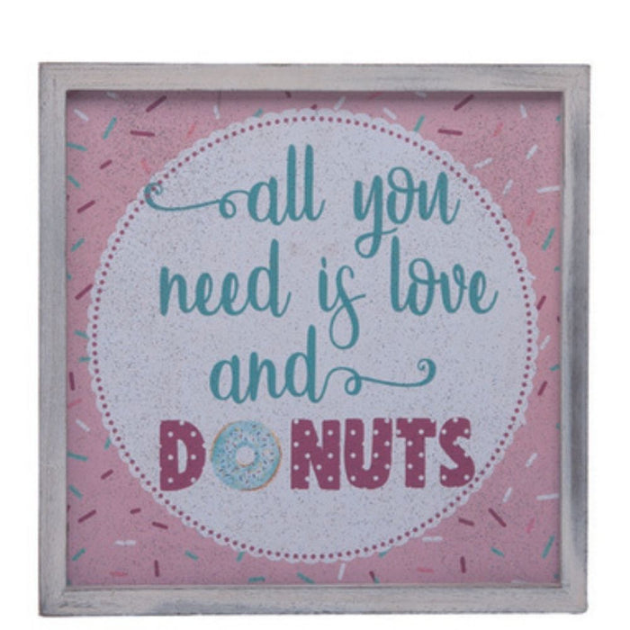 The MDF Donut Love Block Assorted A3216 is a charming framed sign with the phrase all you need is love and donuts in decorative fonts against a pink backdrop with colorful sprinkles, beautifully capturing sweet indulgence and joy.