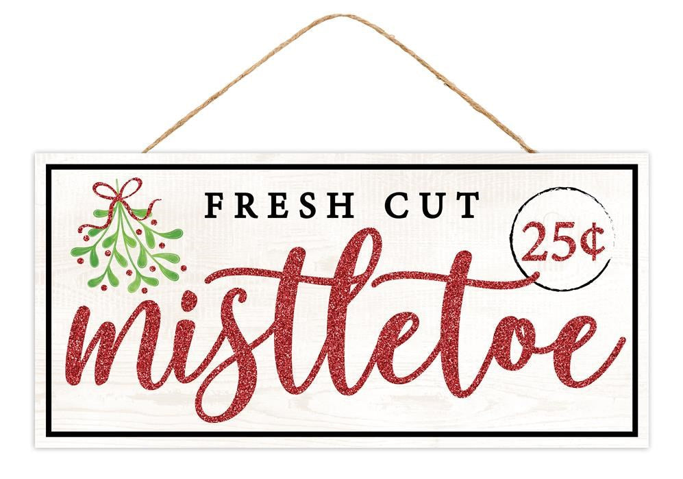 The 12.5L x 6H Fresh Cut Mistletoe Sign (AP8930) features a mistletoe sprig and Fresh Cut Mistletoe 25¢ text in white, red, green, and black, hanging by twine for a festive touch.
