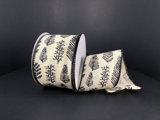 A roll of Ivory Canvas/Black Fern-Holly Branches 2.5" x 10Y ribbon (71177-40-21), partially unrolled, displayed against a plain black background.