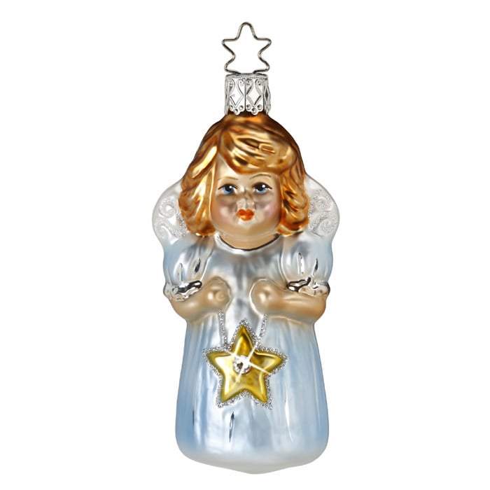 The Star Child Angel Christmas Ornament by Inge-Glas (1-016-16) is a handmade German glass angel adorned with golden hair, wings, and a blue robe. The angel holds a yellow star and includes a silver star-shaped hook for hanging.