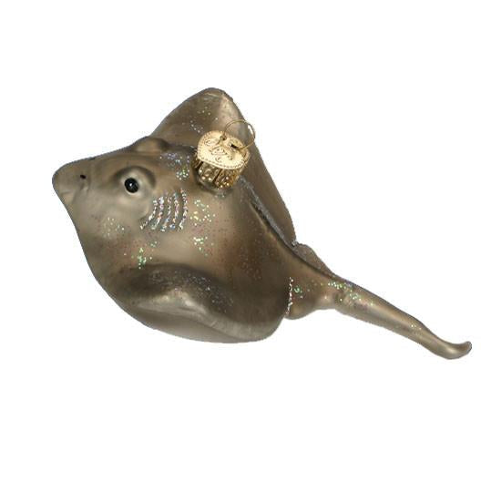 The Stingray Old World Christmas Ornament 12397 is a glass ornament shaped like a stingray, featuring metallic paint, glitter accents, and a gold hanging cap.