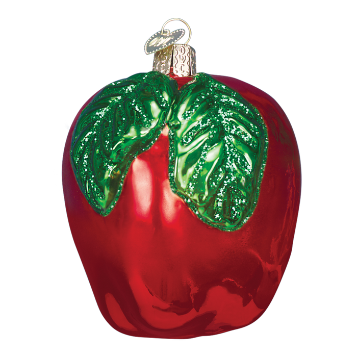 The Red Apple 28114 Old World Christmas Ornament is a hand-painted glass ornament shaped like an apple, featuring two green leaves and a gold hanging loop at the top.
