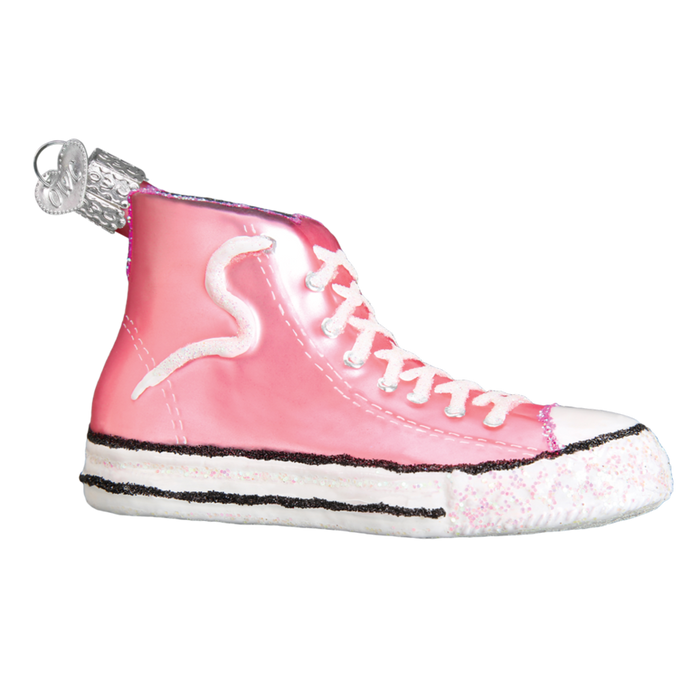 The Pink High-Top Sneaker 32315 Old World Christmas Ornament features a hand-painted shiny pink glass design with white laces, a striped sole, hanging loop, side swirl, and glitter—making it a unique addition to your Christmas décor.