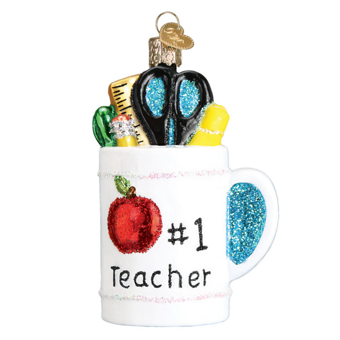 The Best Teacher Mug 32318 Old World Christmas Ornament features a “#1 Teacher” label, red apple, and glittery school supplies—ideal for brightening any teacher’s holiday décor.