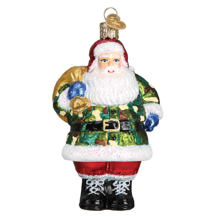 The Camo Santa 40299 Old World Christmas Ornament features hand-painted glass with Santa in a camouflage jacket, red pants, black boots, and carrying a gold sack over his shoulder.