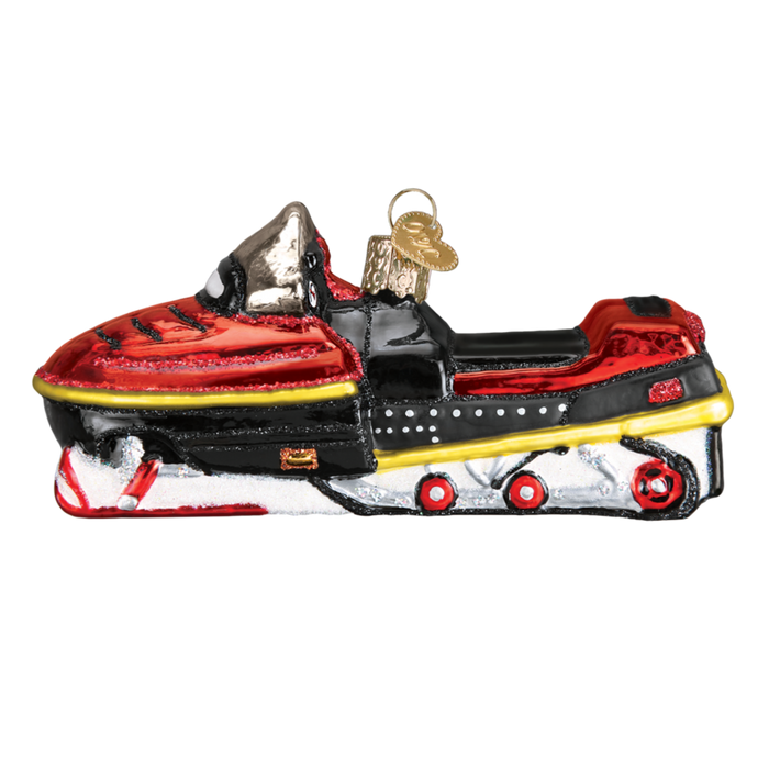 The Snowmobile 46074 Old World Christmas Ornament is a mouth-blown glass ornament shaped like a red, black, and yellow snowmobile, featuring shiny details and a gold hanging loop.