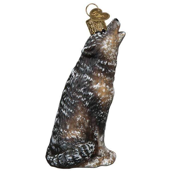 The Vintage Howling Wolf 51005 Old World Christmas Ornament by Old World Christmas features a textured gray and white coat, upright pose with head raised, and comes with a gold cap and loop for hanging.
