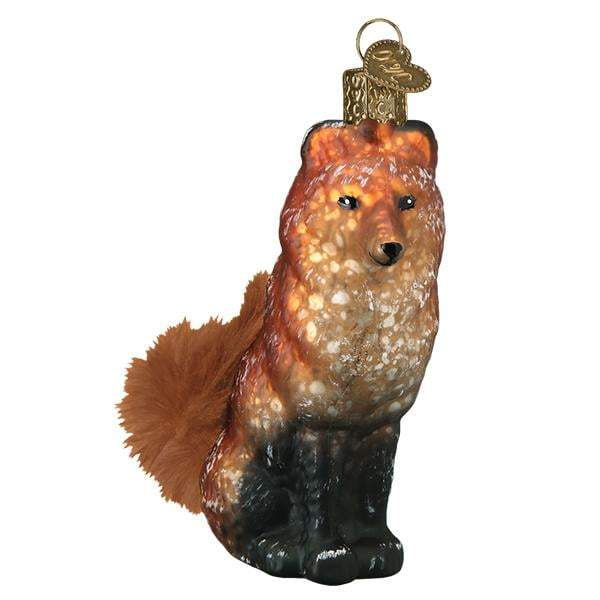 The Vintage Fox 51006 Old World Christmas Ornament, from the Vintage Woodland Collection, artfully depicts a fox with detailed fur and a bushy tail. It features a gold hook on top for hanging, adding a classic touch reminiscent of Old World Christmas traditions.