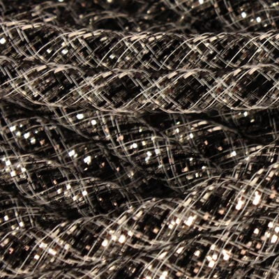 Close-up of Deco Flex Tubing Black Silver Stripe Metallic Foil (RE3010E1) braided cords in a crisscross pattern, reflecting light and creating a textured, shiny surface—ideal for unique holiday creations.