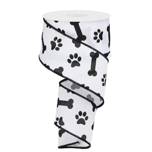 The 2.5 White with Black Paw Print & Bones Ribbon (RGA114827) charmingly displays its playful pattern of black dog bones and paw prints as it unrolls.
