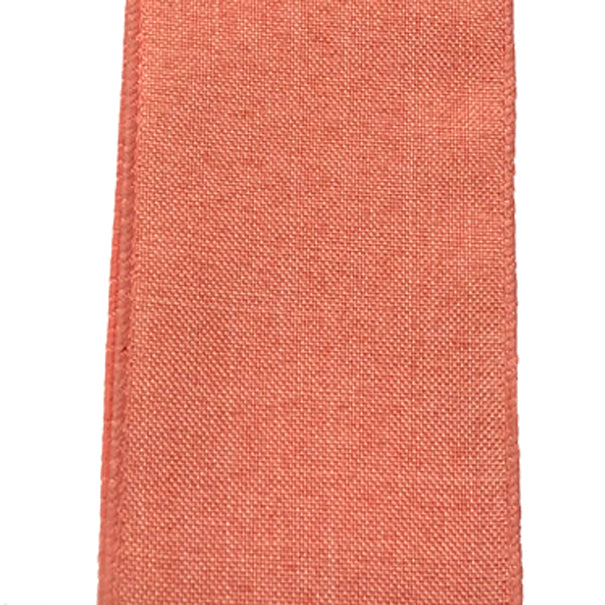 Close-up of the 2.5 Coral Canvas Ribbon X314840-46 swatch reveals a textured, slightly rough canvas surface with an even soft coral hue.