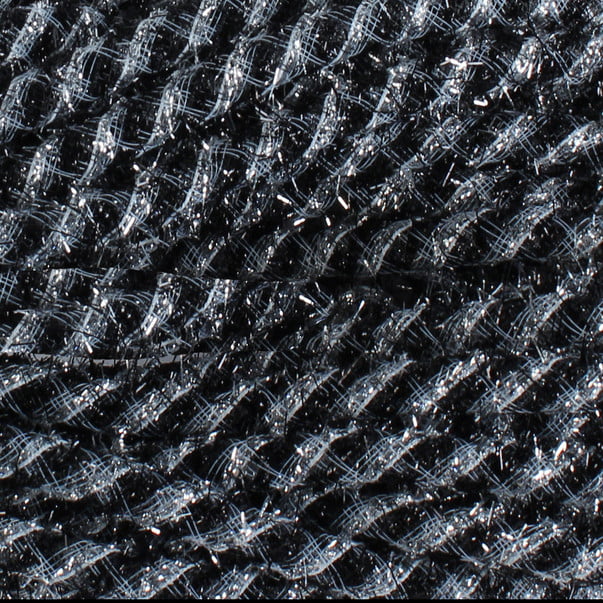 A close-up of the Tinsel Flex Tubing Black Silver RE3542E1 reveals a grid-like design with interwoven threads. The material resembles metallic tinsel, blending shiny and matte fibers for a textured appearance with a slight sheen.