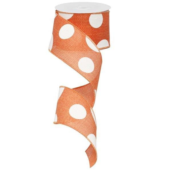 The partially unwound 2.5 Giant Multi Dot Salmon White Ribbon (RG0120094) is shown on a plain white background, featuring vibrant orange with charming white polka dots.