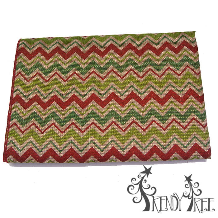 A 54" square table cloth featuring natural, lime, emerald, and red chevron stripes. The Trendy Tree logo appears in the bottom right corner.
